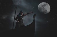 a viking woman on a boat with a gun in her hand